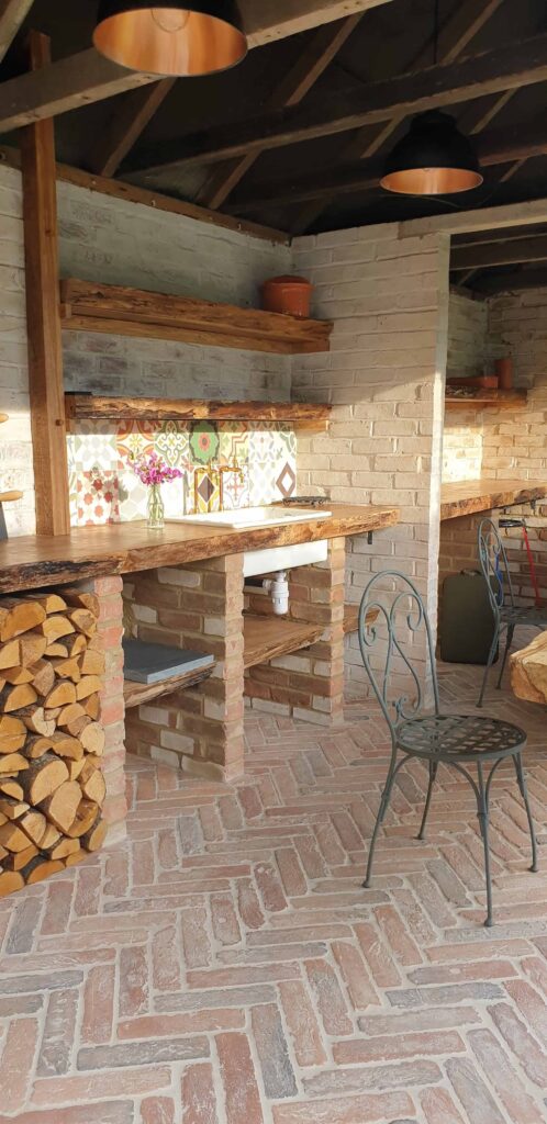 Outdoor terrace area with herringbone brick floor